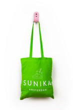 Load image into Gallery viewer, green tote bag hanging on pink wall hook