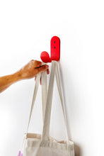 Charger l'image dans la galerie, red wall hook with white tote bag
