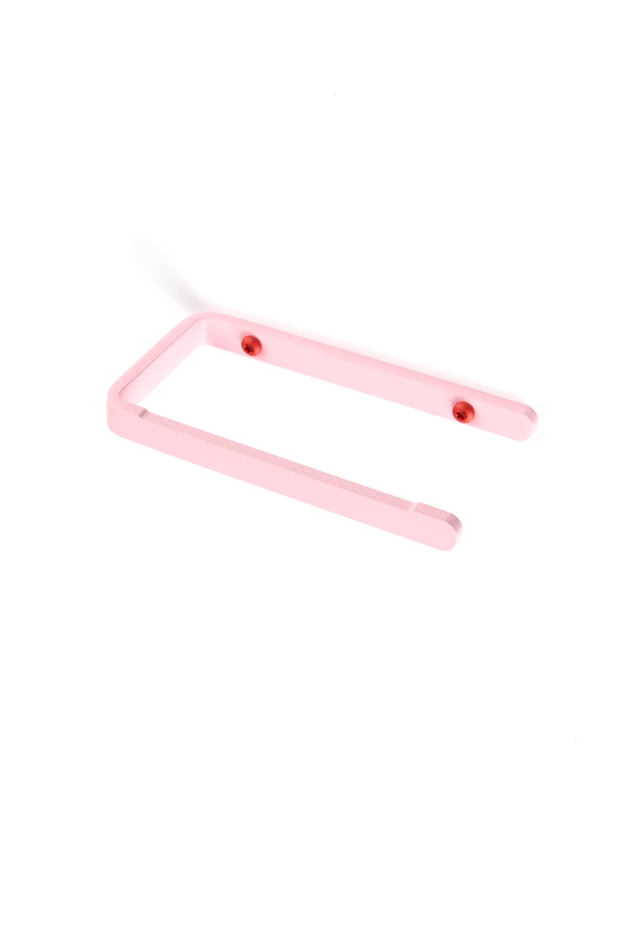 Pink toilet paper holder with red screws