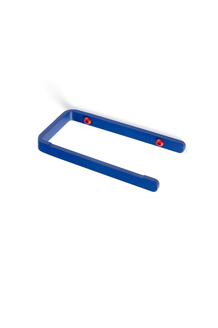 deep blue toilet paper holder with red screws