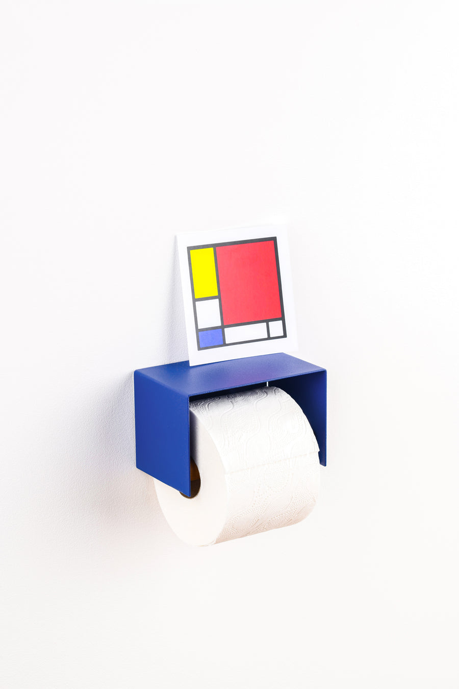 blue toilet paper holder in nice design where you can put things on top like a phone or candle or some small accessories. 