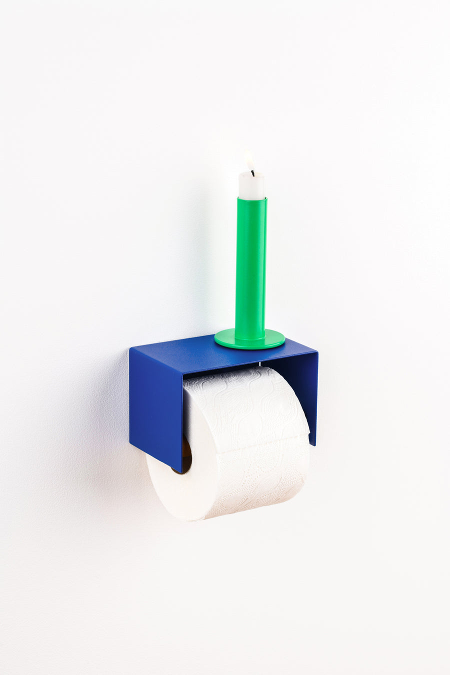 blue toilet paper holder in nice design where you can put things on top like a phone or candle or some small accessories. 