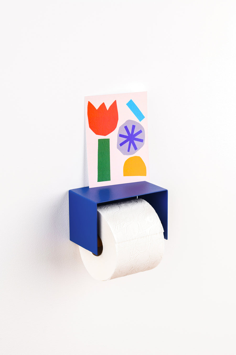 blue toilet paper holder in nice design where you can put things on top like a phone or candle or some small accessories. 