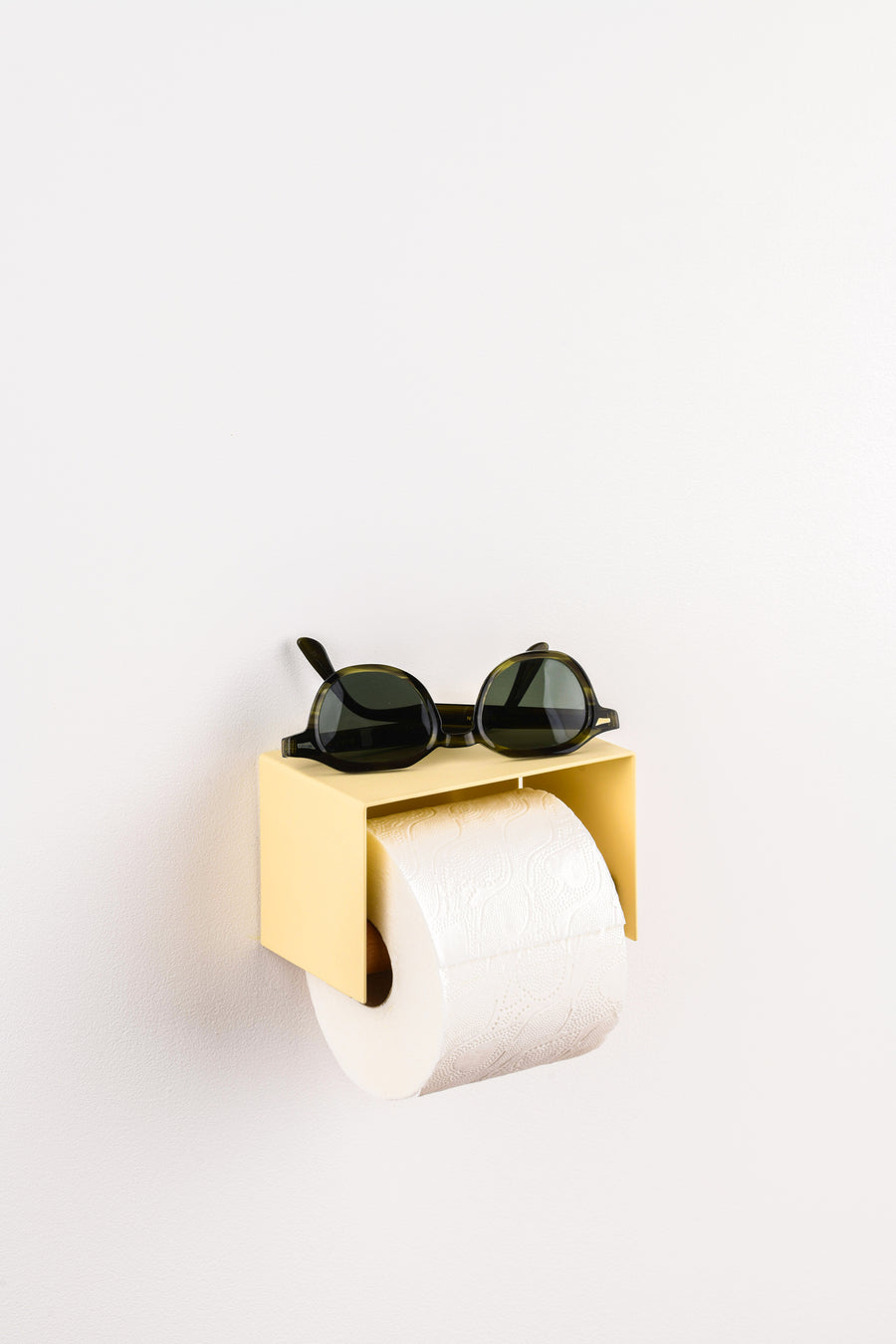 ivory cream white toilet paper holder in nice design where you can put things on top like a phone or candle or some small accessories.  