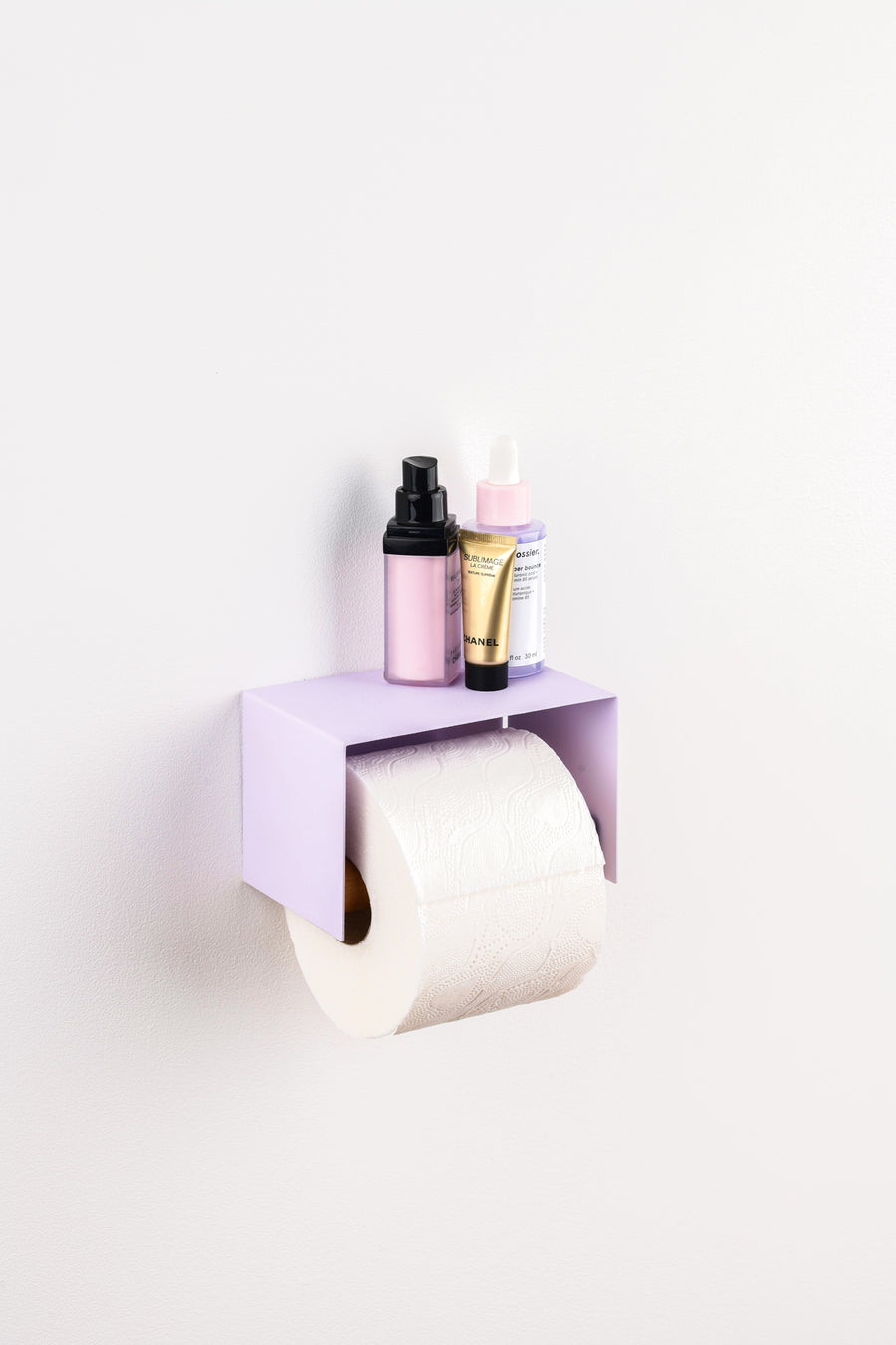 lavender purple toilet paper holder in nice design where you can put things on top like a phone or candle or some small accessories.  