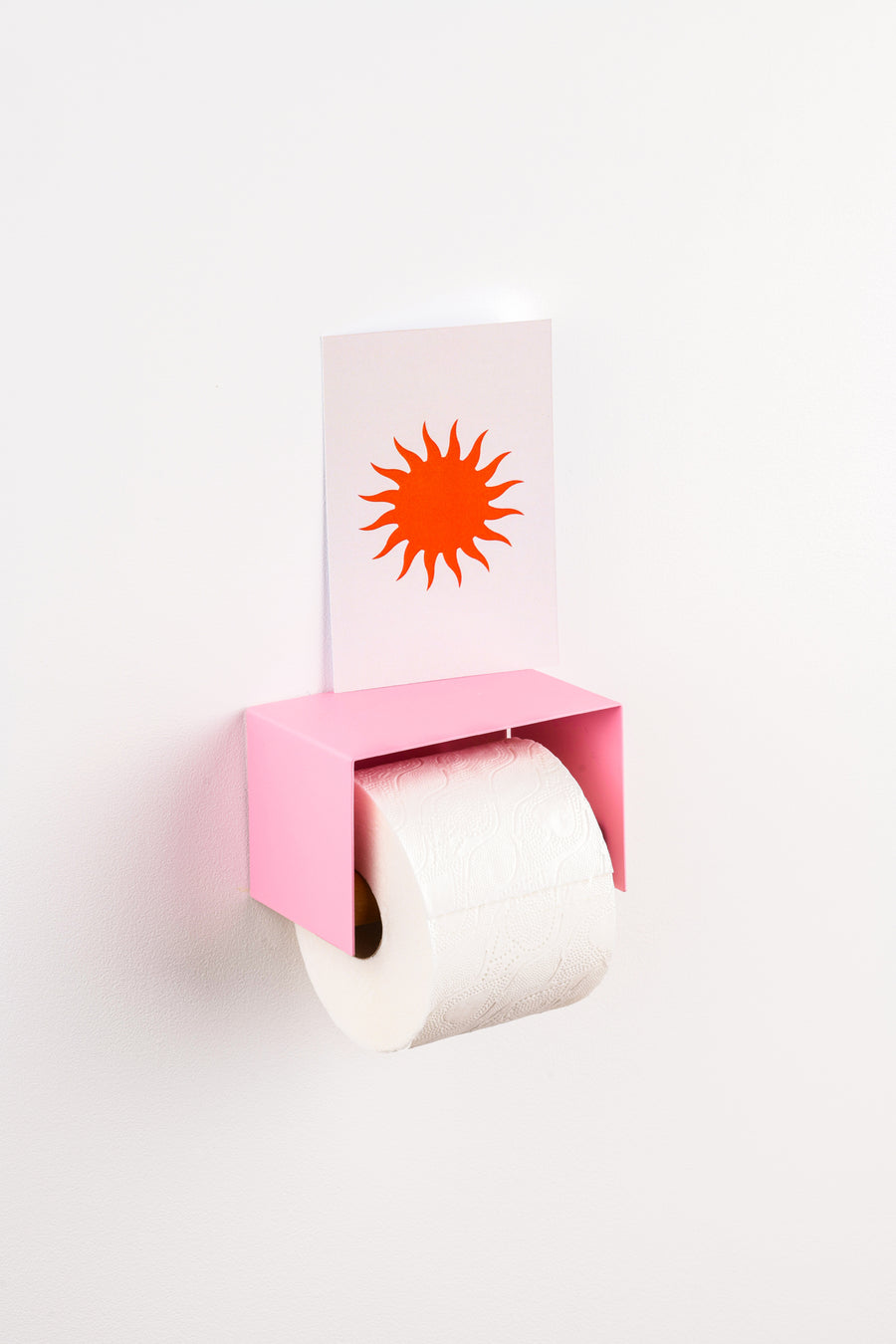 pink toilet paper holder in nice design where you can put things on top like a phone or candle or some small accessories.  