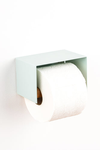 sage green toilet paper holder in nice design where you can put things on top like a phone or candle or some small accessories.  