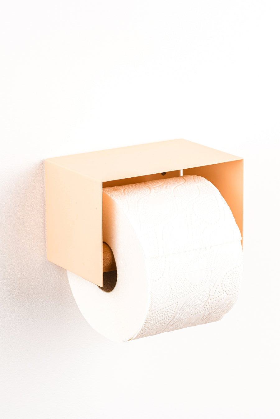 salmon pink toilet paper holder in nice design where you can put things on top like a phone or candle or some small accessories.  