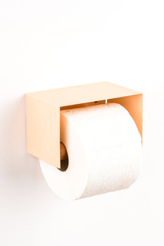 salmon pink toilet paper holder in nice design where you can put things on top like a phone or candle or some small accessories.  