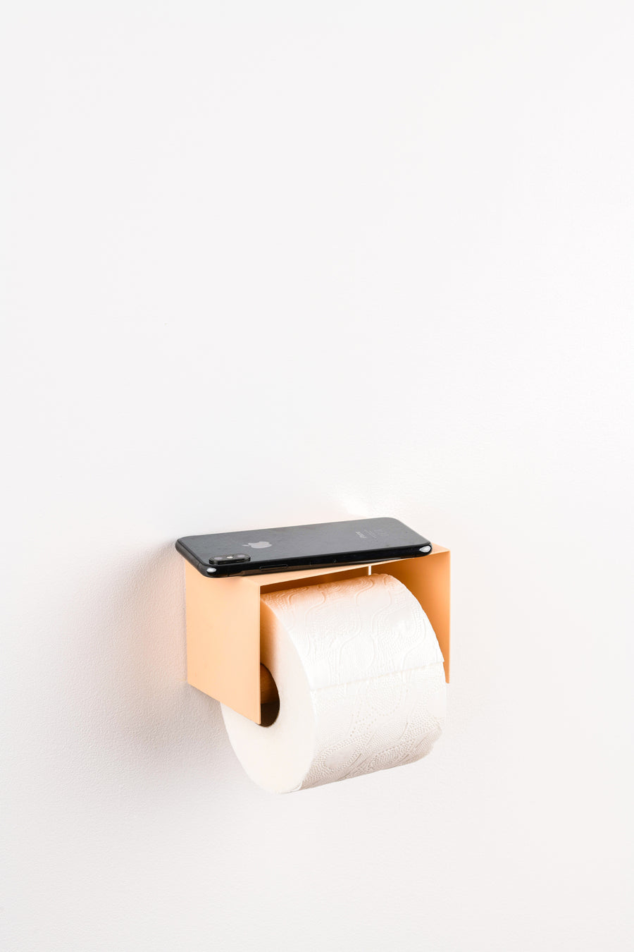 salmon pink toilet paper holder in nice design where you can put things on top like a phone or candle or some small accessories.  