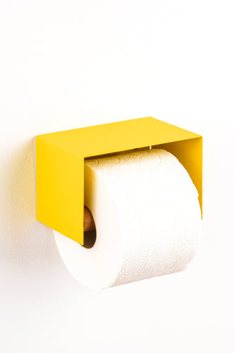 yellow toilet paper holder in nice design where you can put things on top like a phone or some small accessories