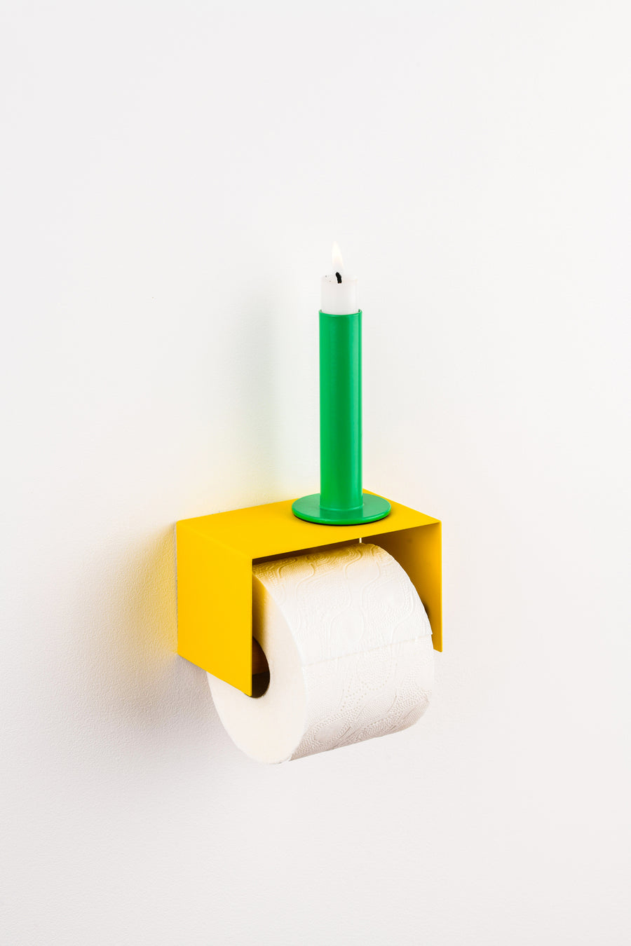 yellow toilet paper holder in nice design where you can put things on top like a phone or a candle or some small accessories