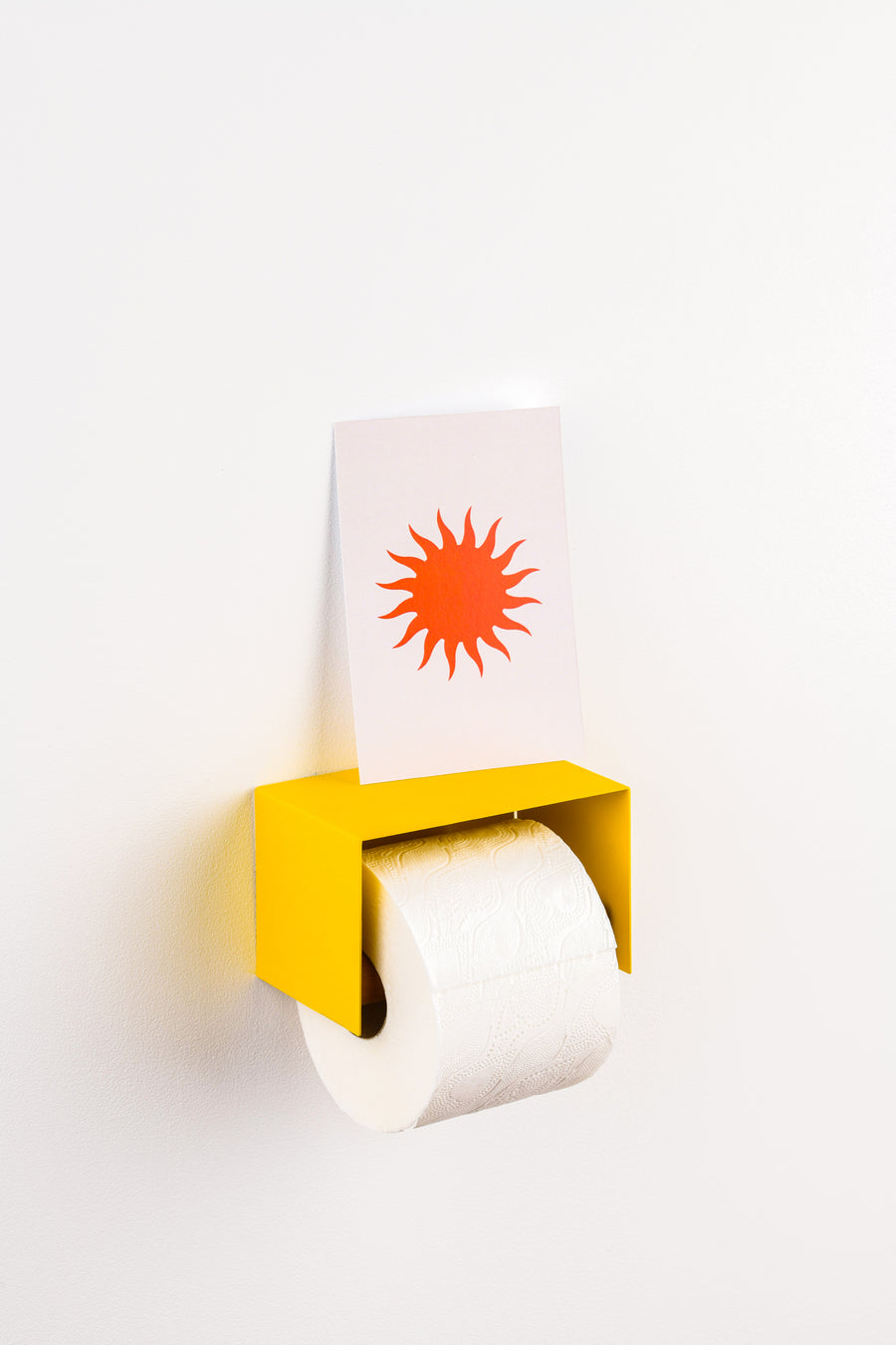 yellow toilet paper holder in nice design where you can put things on top like a phone or some small accessories