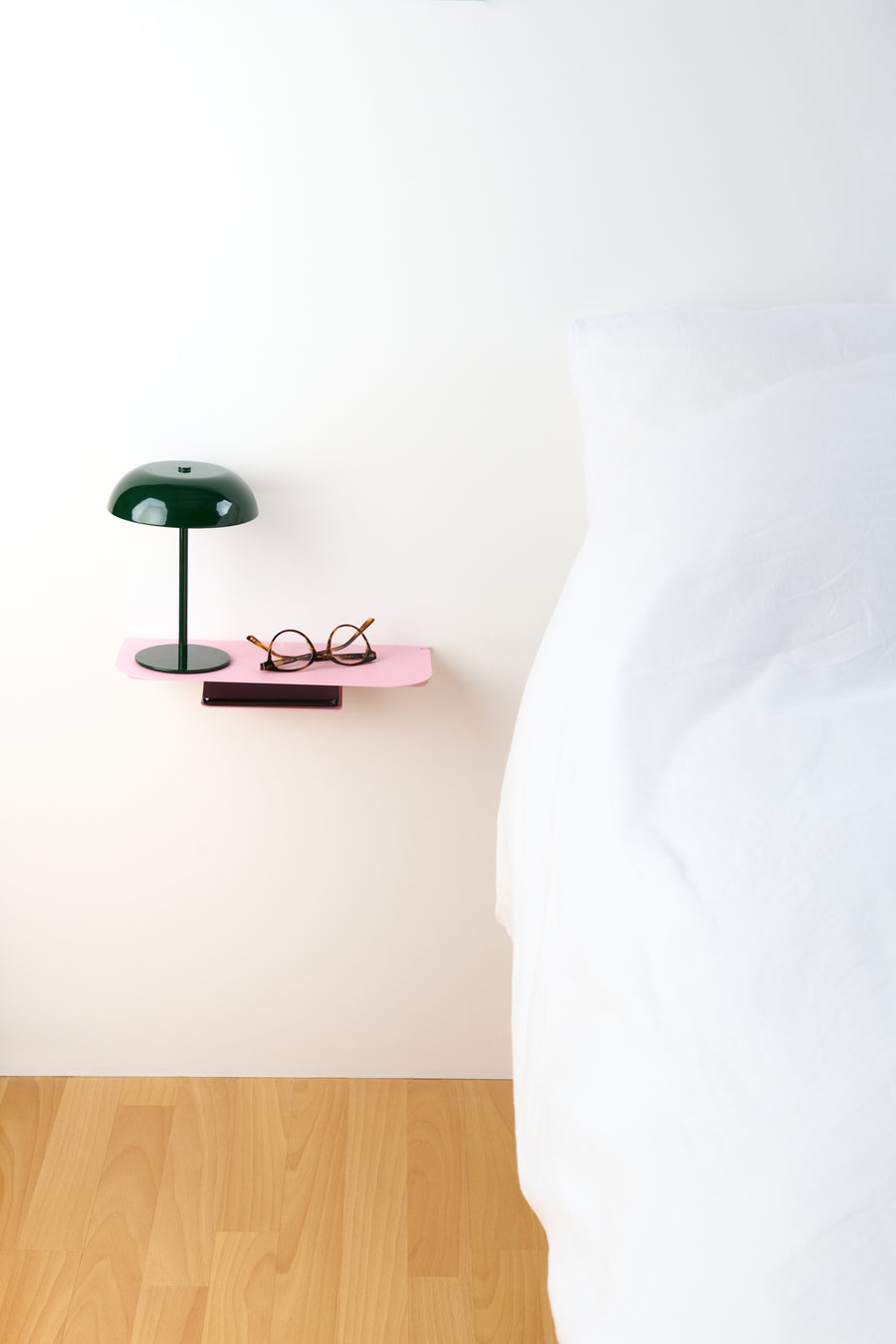 compact pink wall shelf made from powder coated stainless steel. High quality and sleek design. Fits in any room