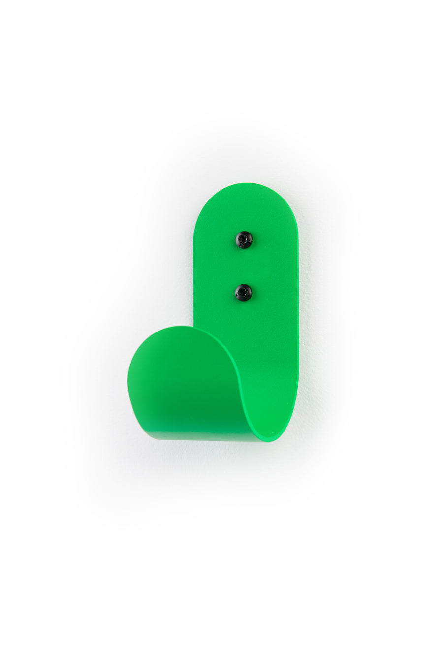 green wall hook with black screws on white background