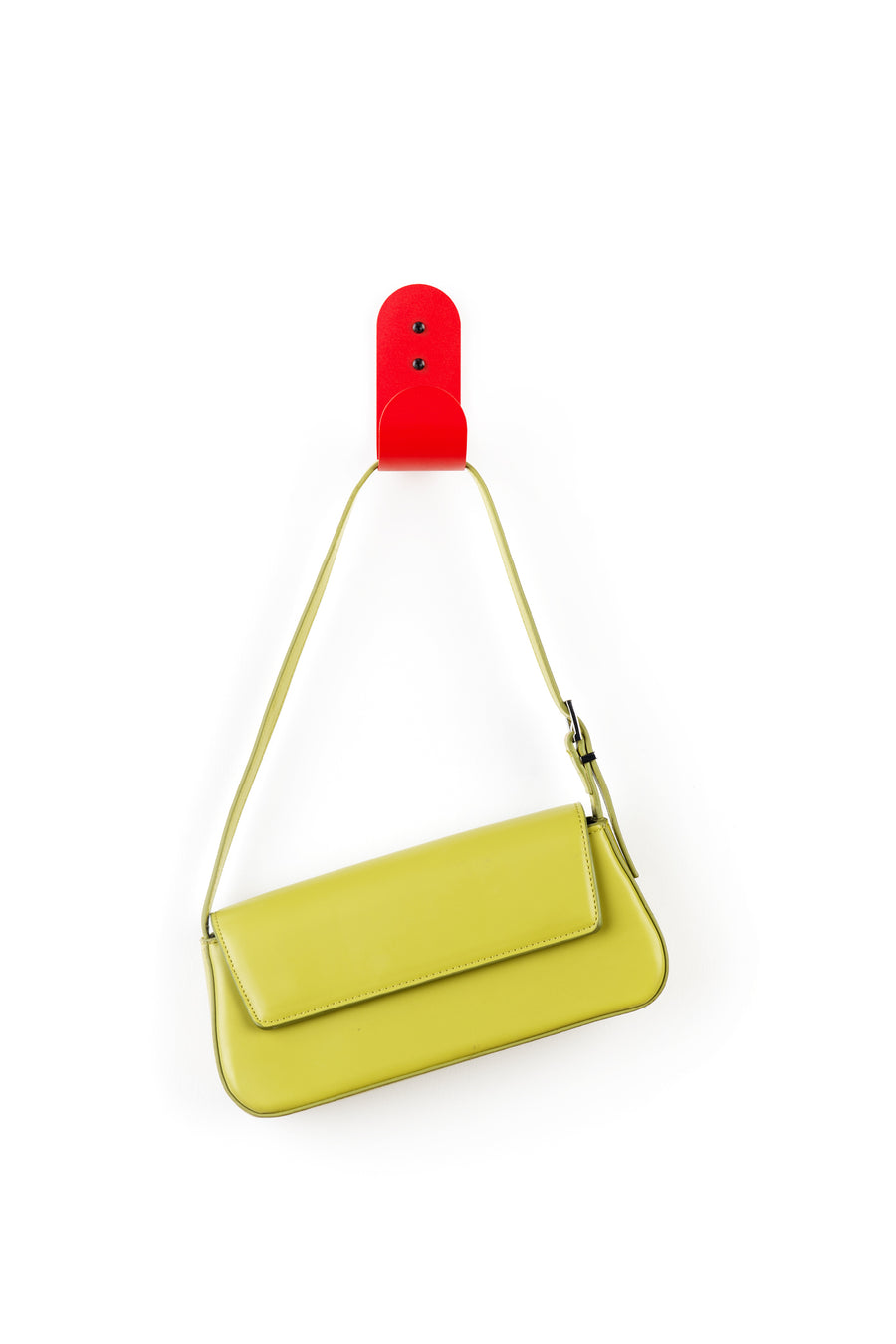 red wall hook with green purse