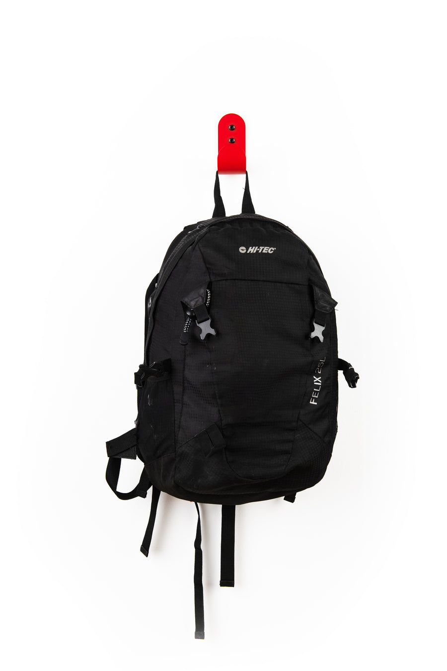 red wall hook with black hi-tec backpack
