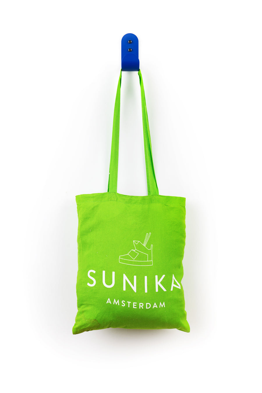 blue wall hook with green sunika amsterdam tote bag