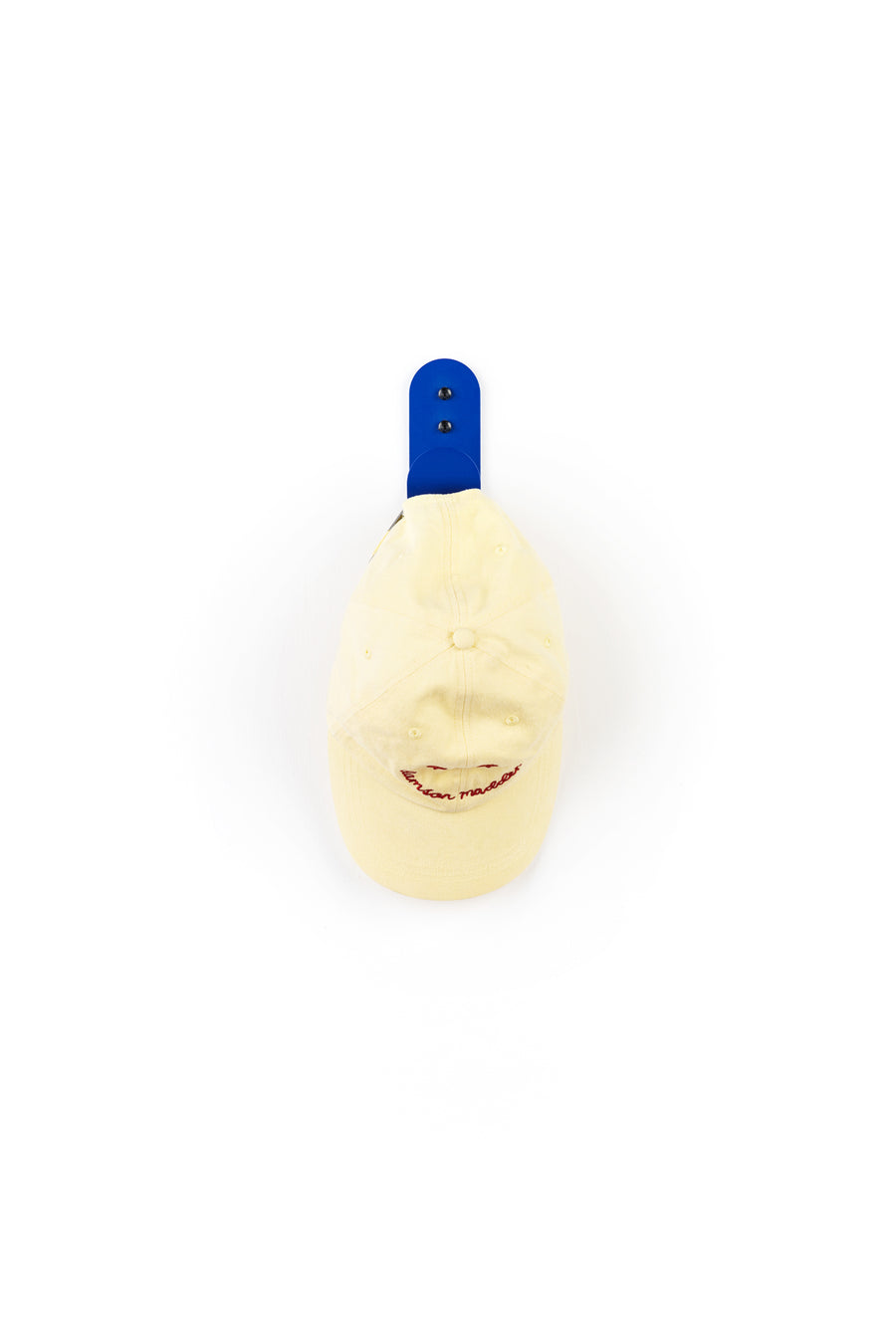 blue wall hook with light yellow cap
