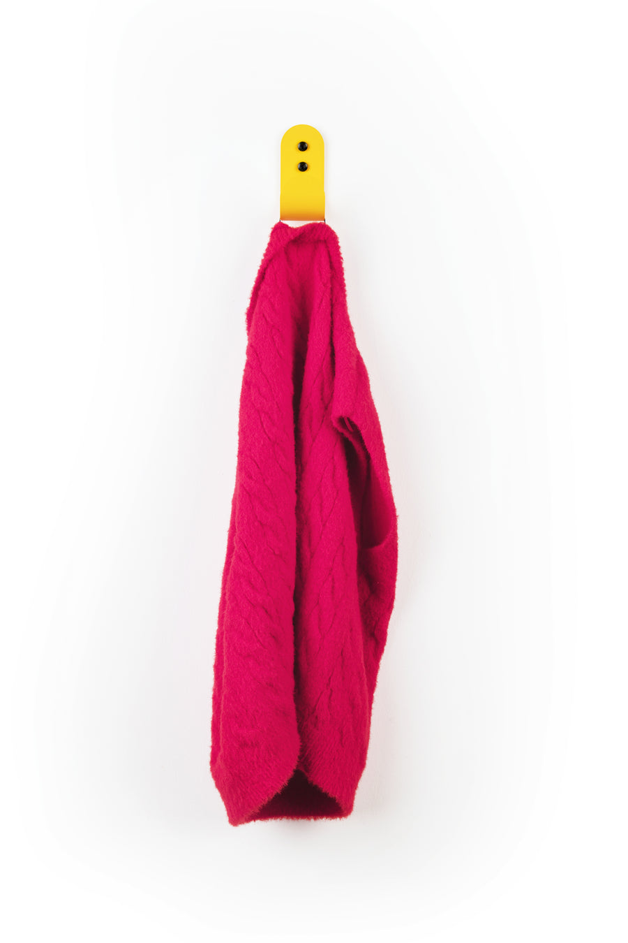yellow wall hook with red sweater