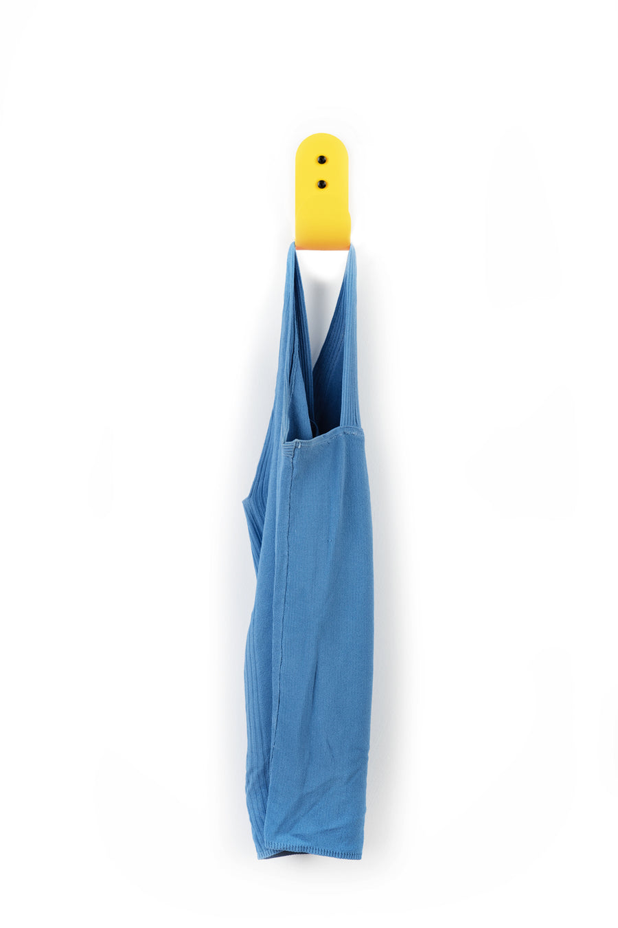 yellow wall hook with blue shirt