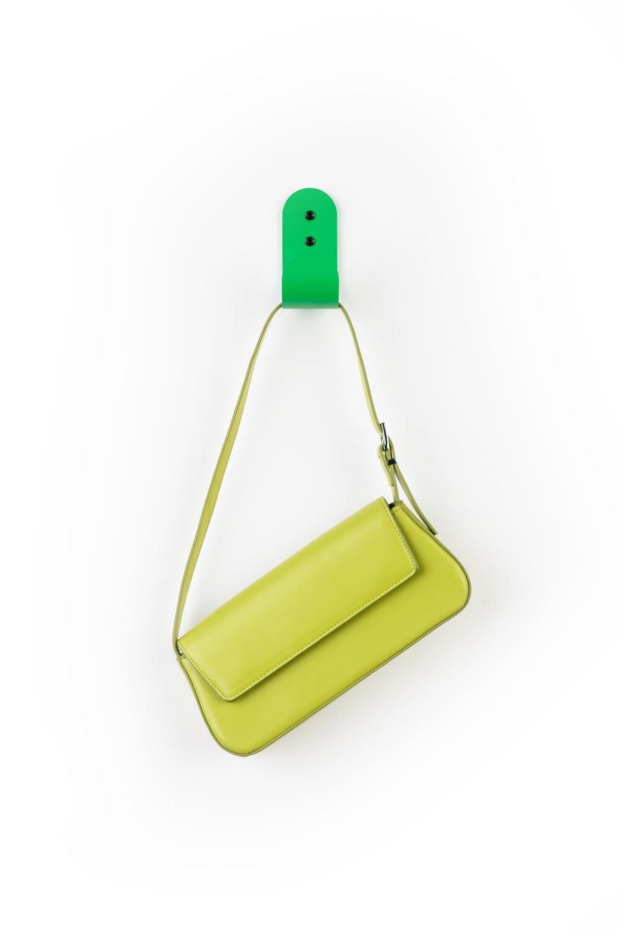 green wall hook with green purse