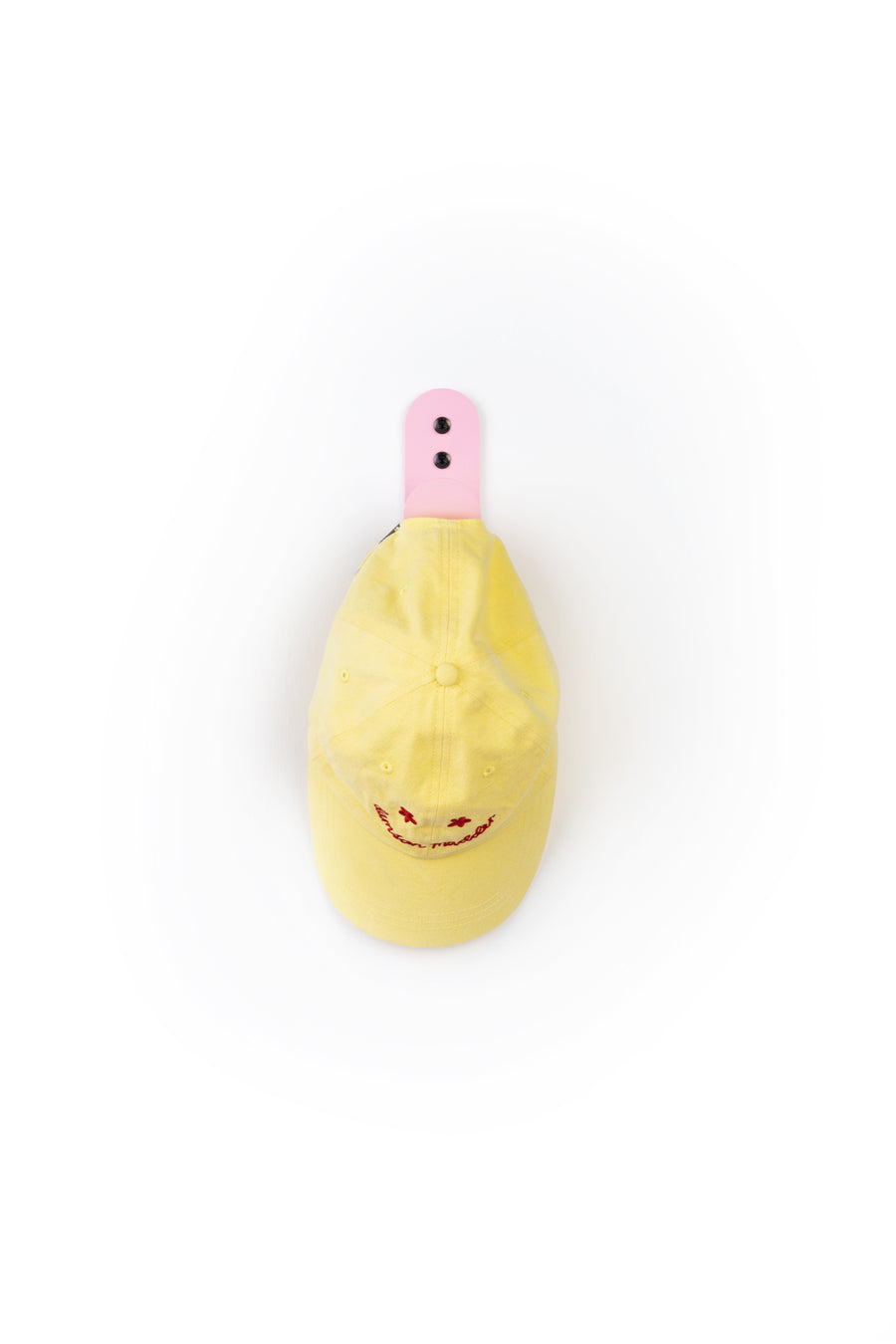 pink wall hook with yellow cap