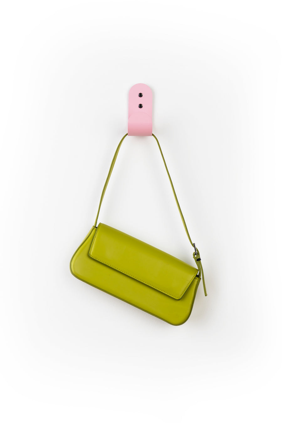pink wall hook with green purse